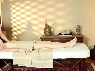 Filmed young beauty gets massaged